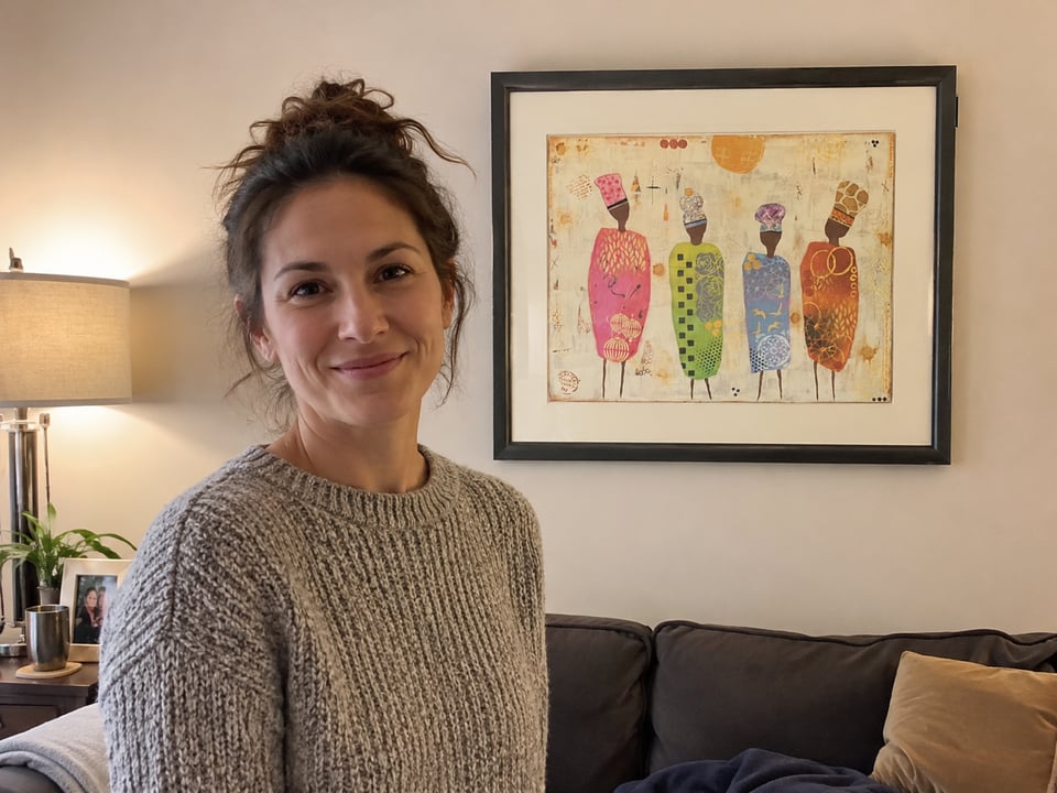 Charlotte standing in front of her memorial painting
